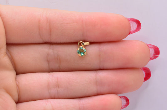 Dije Esmeralda redondo / 0.39 Gr / 1 Cm / Oro amarillo 18k