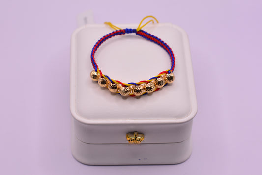 Pulsera tejida Colombia balines 7mm / 1.52 Gr / Oro amarillo 18k