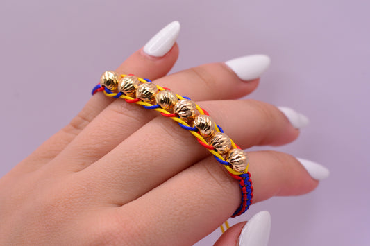 Pulsera tejida Colombia balines 7mm / 1.52 Gr / Oro amarillo 18k